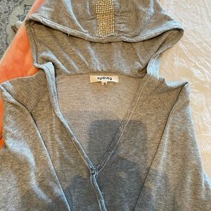 Wrap blouse/ sweatshirt with pearls and rhinestones on hood.